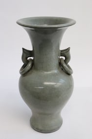A grey glazed crackleware porcelain handled vase