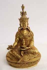A very fine Chinese gilt bronze sculpture of deity