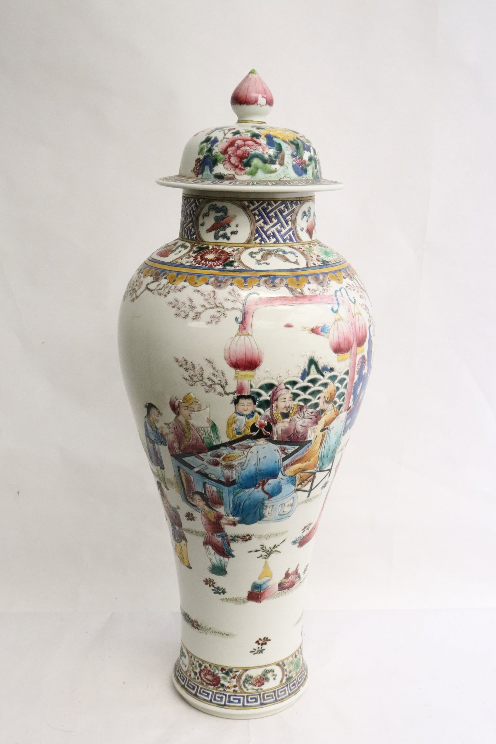 Chinese famille rose porcelain covered jar: Fine Chinese famille rose porcelain covered jar decorated with fairy tale scenes, the neck with 8 treasure items, 20.35"x8.15"dia
