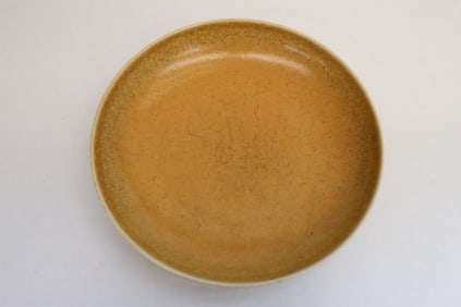 A light brown glazed porcelain plate