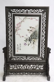 A framed famille rose porcelain plaque on stand