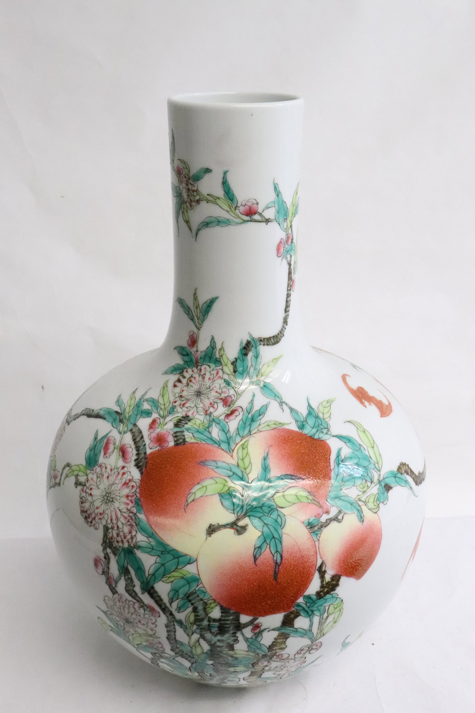 Famille rose porcelain bottle vase: Famille rose porcelain bottle vase with bat and fruit decoration, 13.9"x9.25"dia