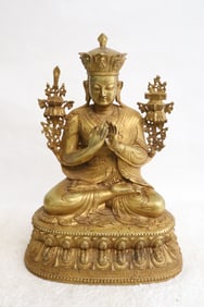 A very fine Chinese gilt bronze sculpture of deity