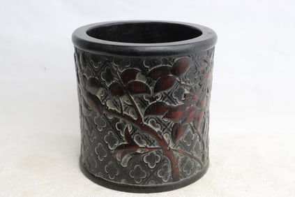 A large wood carved brush holder