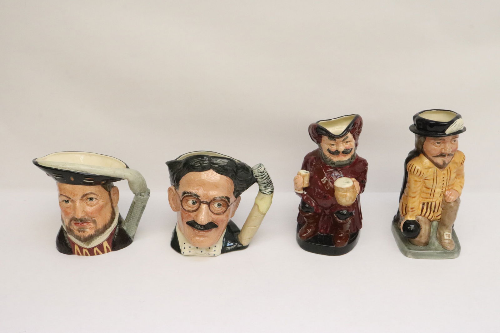 4 Royal Doulton character jars: 4 Royal Doulton character jars, 6.8"x7"x5.7" - 9.1"x5.7"x4.15"