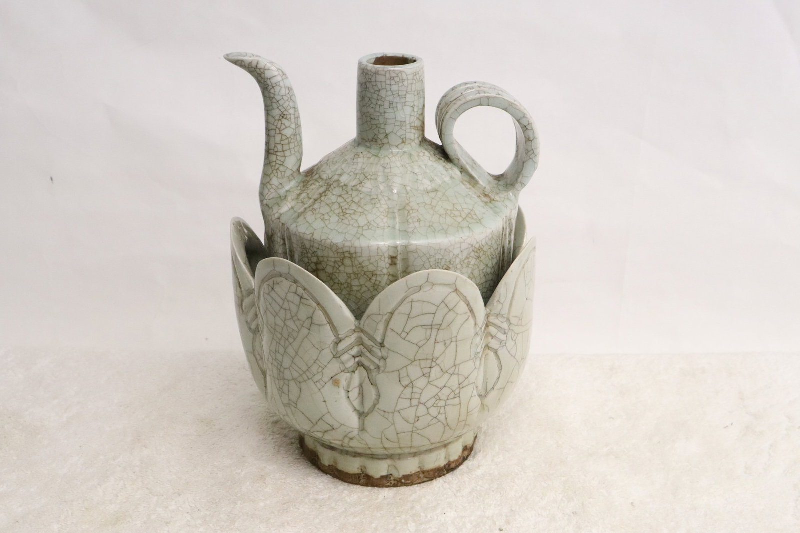 A celadon crackleware wine server w/ under bowl: A celadon crackleware wine server (7.3"x6.15"x5.15") with under bowl (5.35"x6.15"dia)