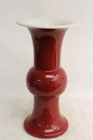 A red glazed porcelain trumpet vase