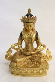 A very fine Chinese gilt bronze sculpture of deity
