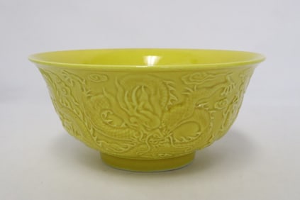 A yellow glazed porcelain bowl