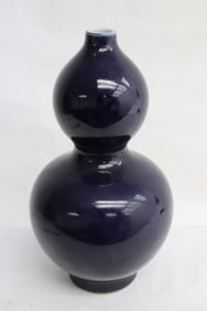 A dark blue glazed porcelain gourd shape vase