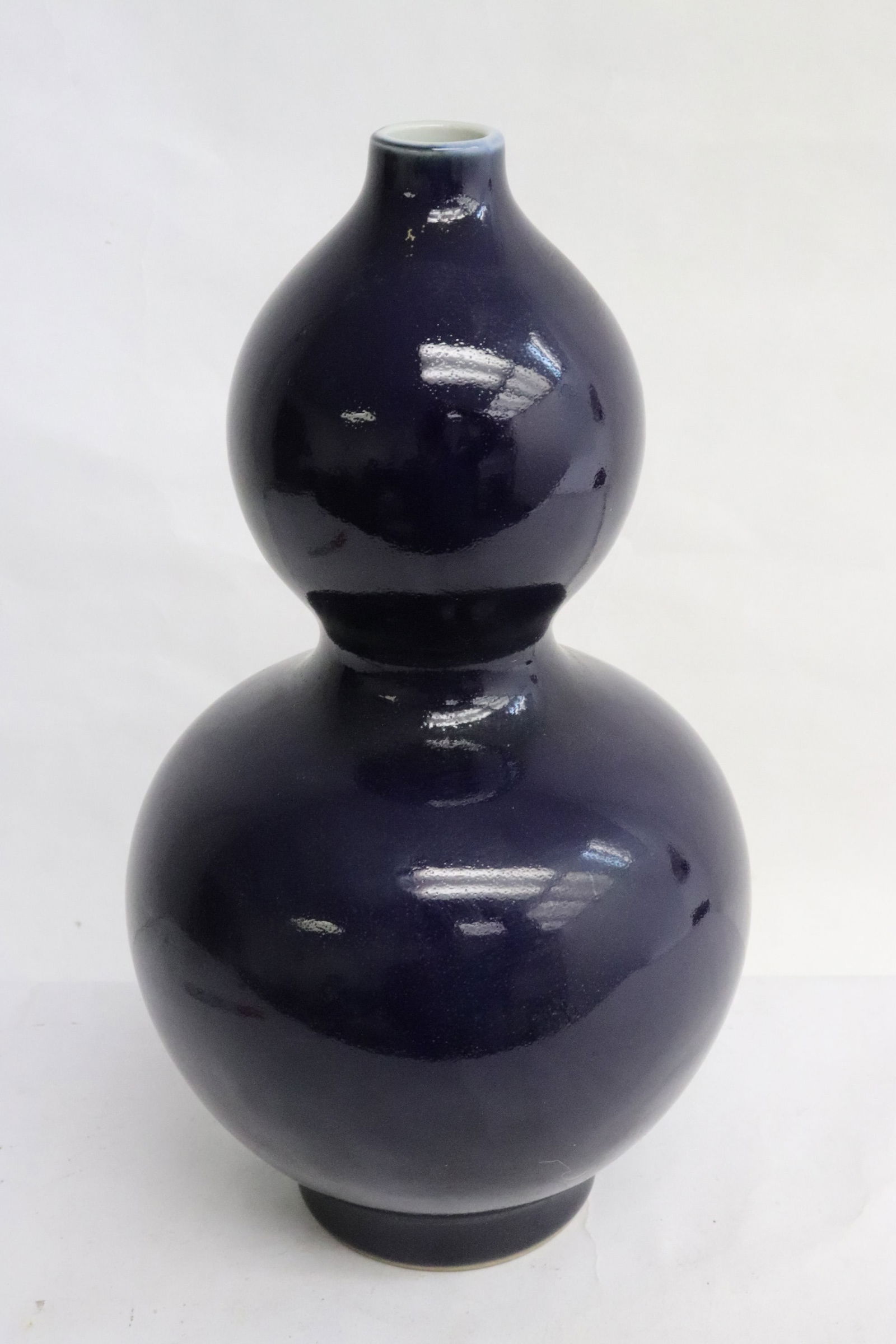 A dark blue glazed porcelain gourd shape vase (1 of 10)