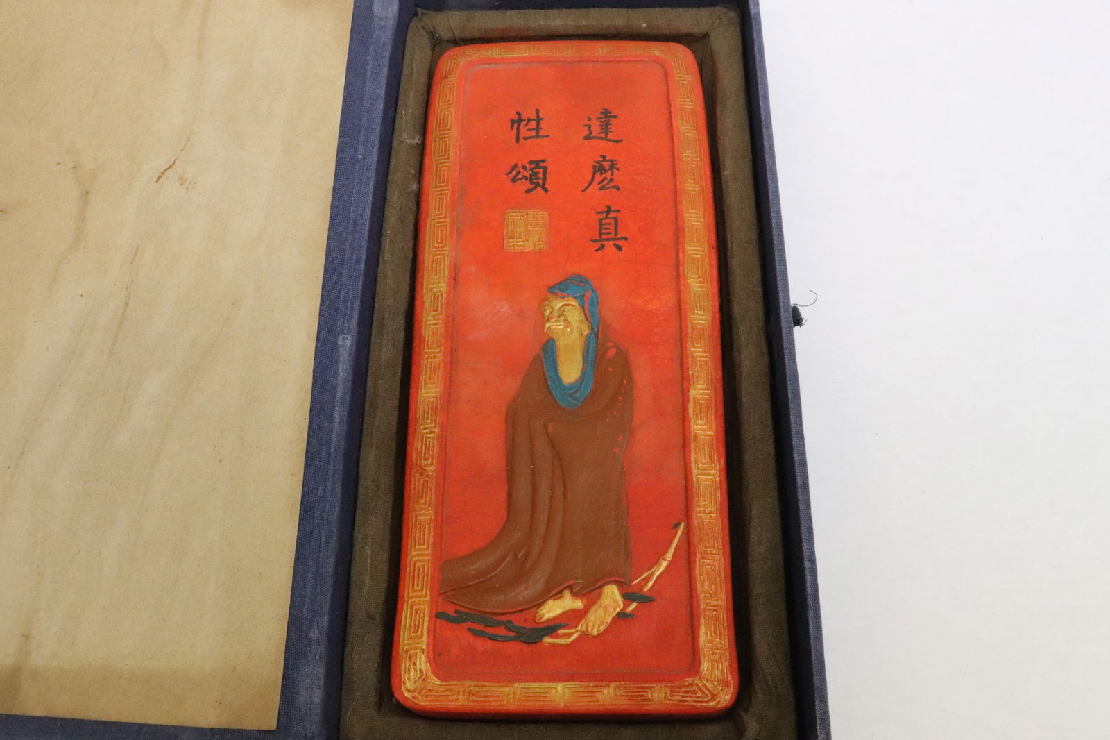 Large red ink stick with portrait of deity (1 of 9)