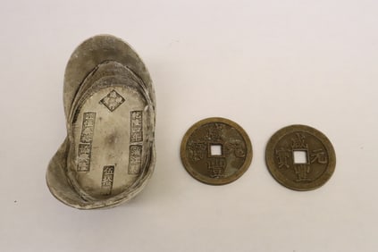 2 reproduction brass coins, & a reproduction ingot
