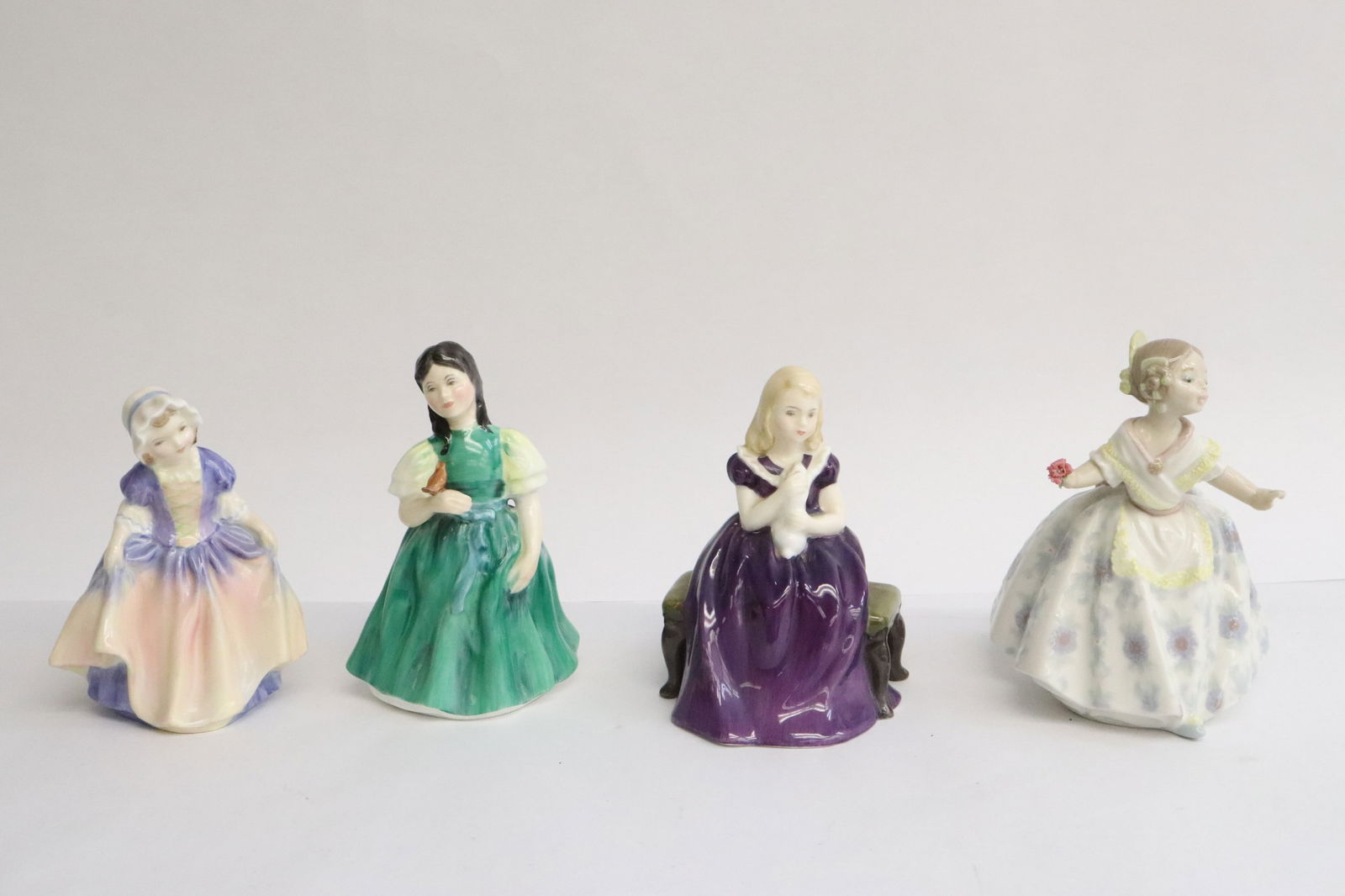 4 Royal doulton figures (1 of 11)