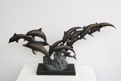 A fine bronze sculpture of dolphin group