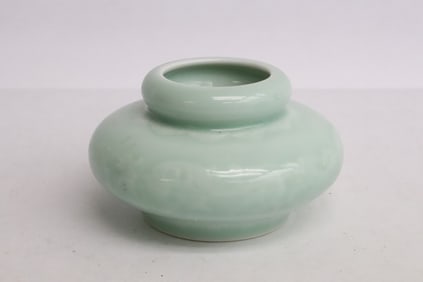 A light sky blue porcelain water dripper