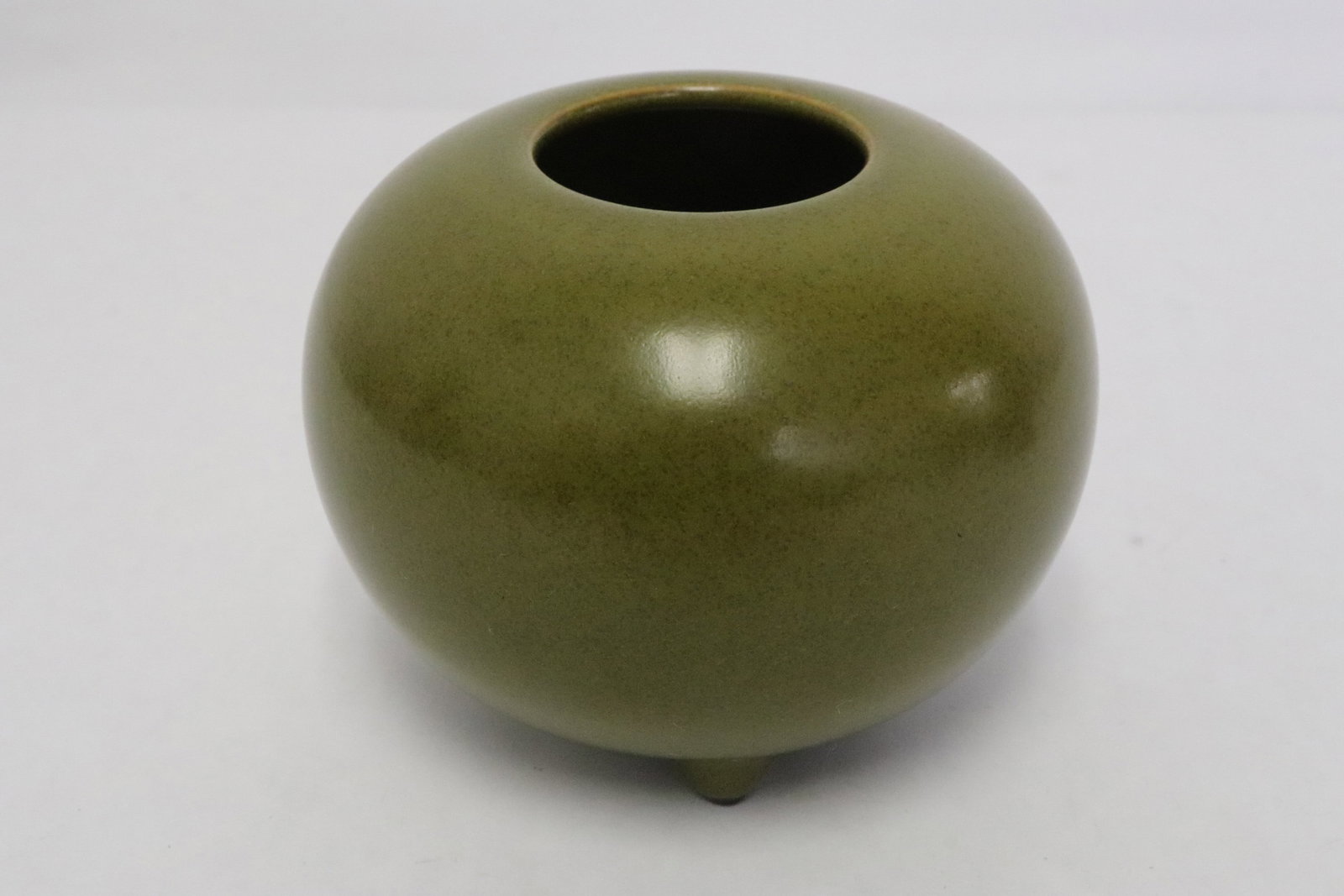 A tea dust glazed porcelain water dripper: A tea dust glazed porcelain water dripper, 3.15"x4.05"dia