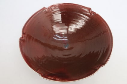 Large red glazed porcelain bowl