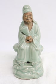 A celadon porcelain sculpture of deity