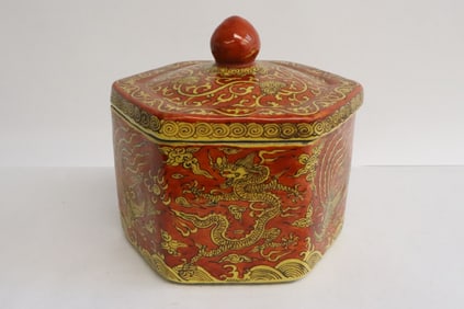 A yellow on red hexagonal porcelain tea caddy