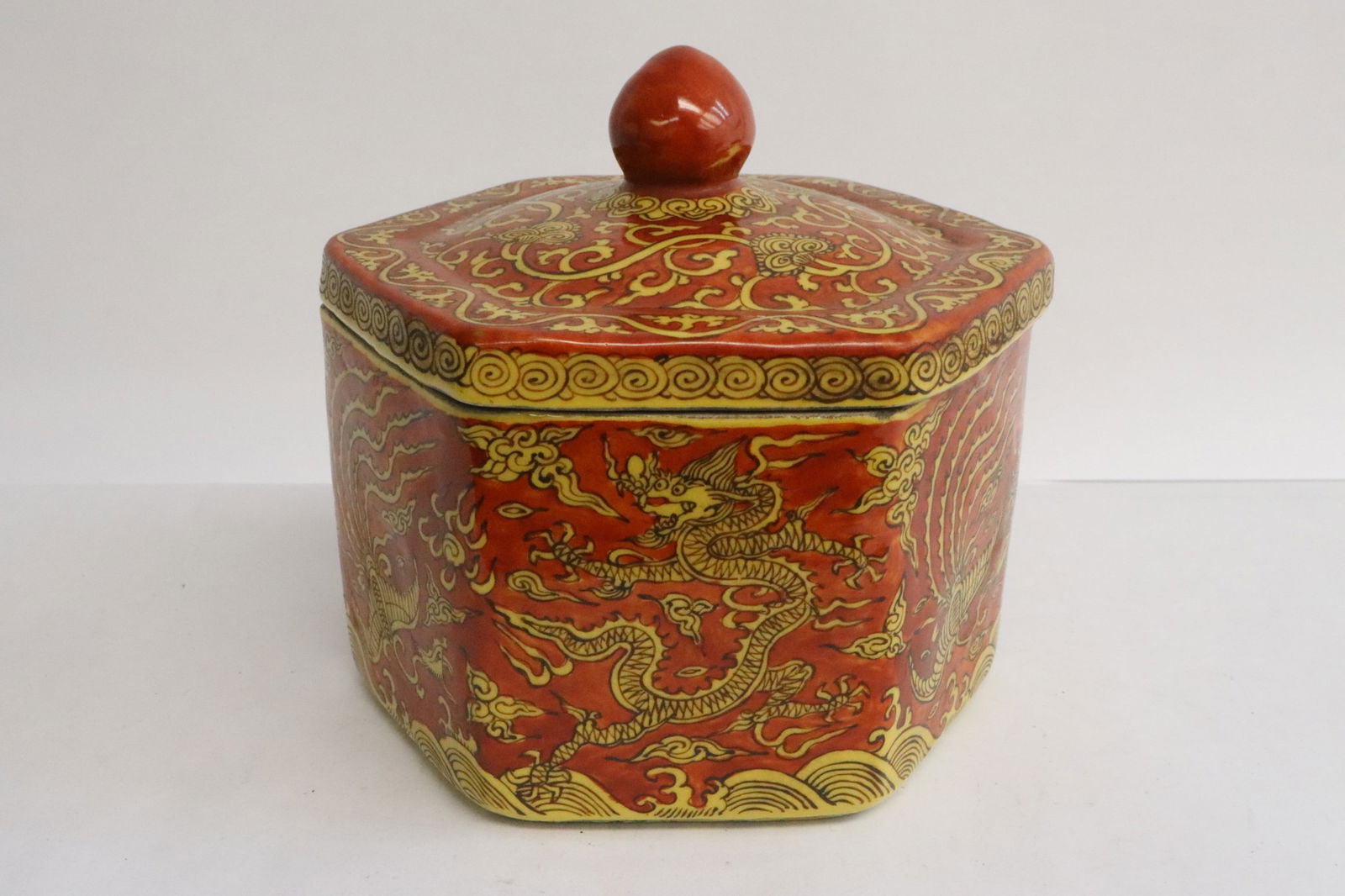 A yellow on red hexagonal porcelain tea caddy (1 of 7)