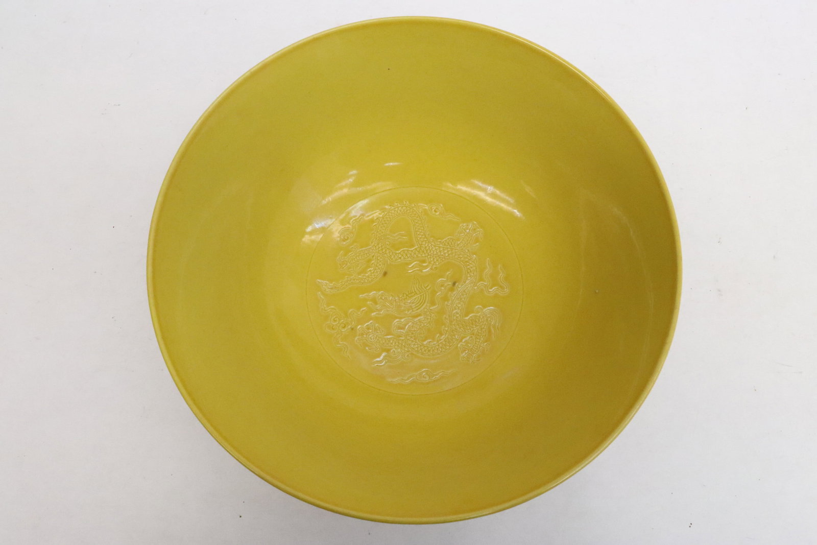 A light purple exterior glazed bowl: A light purple exterior glazed bowl embossed with dragon motif decoration, 3"x7.35"dia