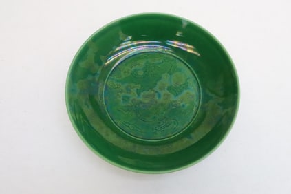 A green glazed porcelain plate