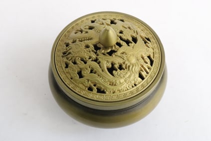 A bronze tripod covered censer
