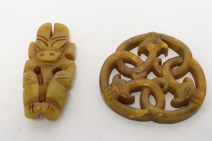 2 stone carved ornaments