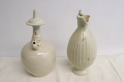2 white porcelain ewers