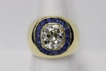 A very heavy 18K Y/G 3.15ct diamond sapphire ring