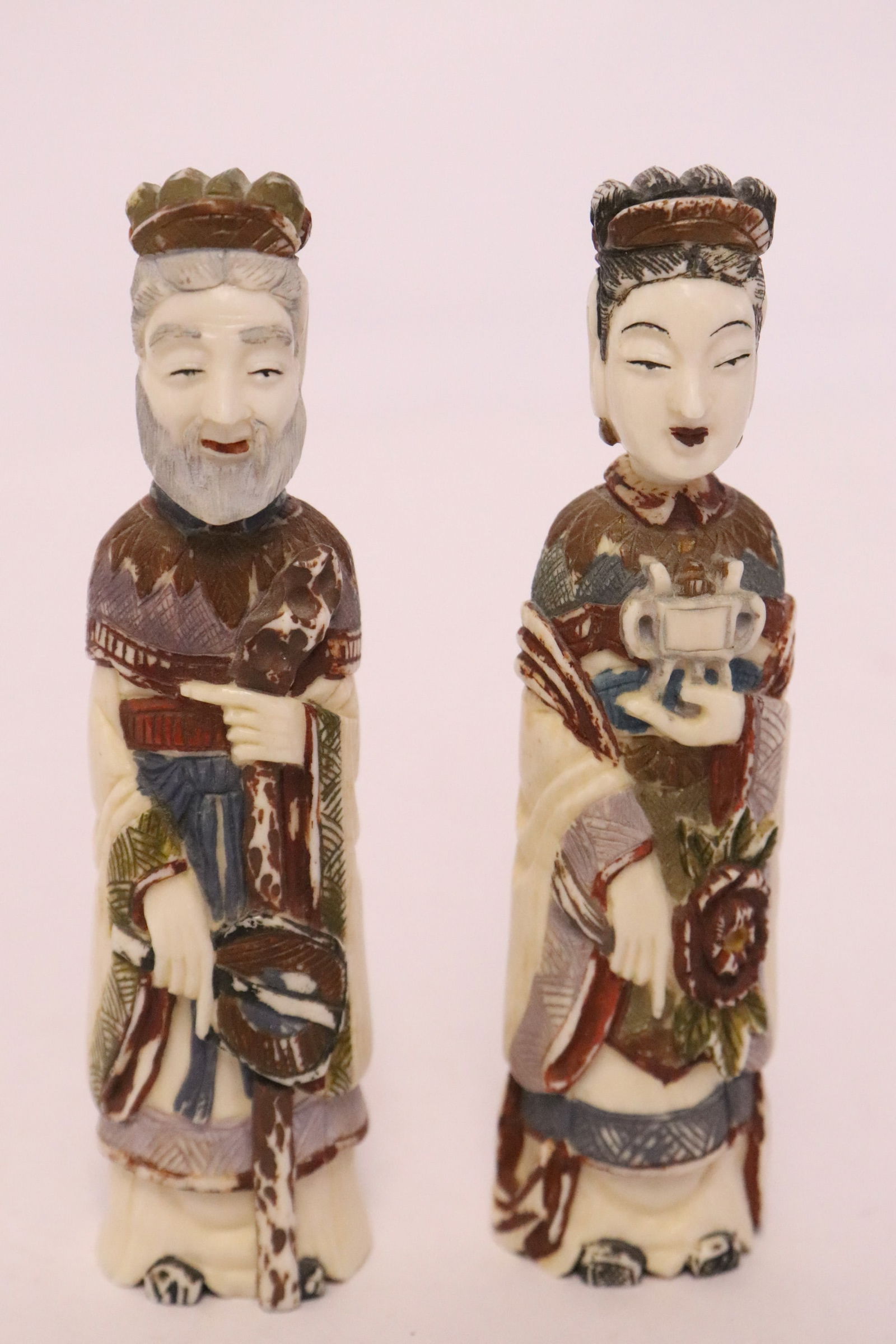 Pair Chinese painted and carved bone snuff bottles: Pair Chinese painted and carved bone snuff bottles in the form of emperor and empress, 4"H ea
