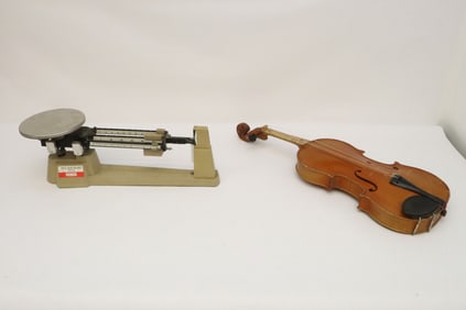 German violin, and a triple beam balance
