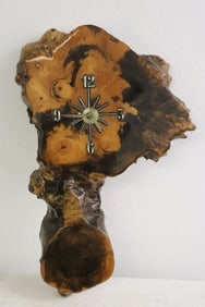 A rootwood framed wall clock