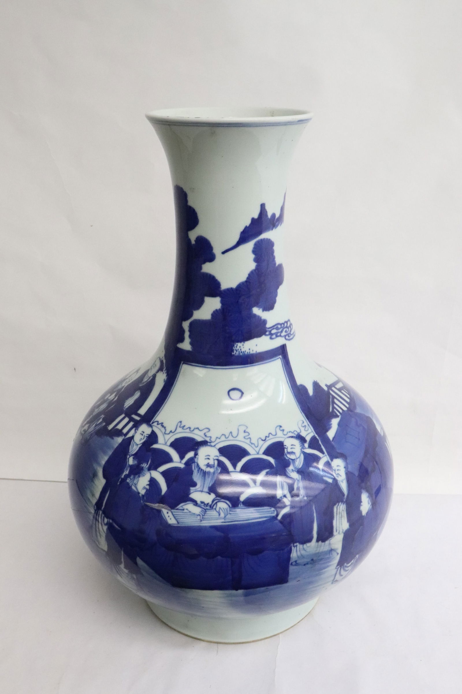 Chinese antique blue & white porcelain bottle vase: Chinese antique blue and white porcelain bottle vase painted with scholar scene, hairline at center, 15.3"x10.2"dia