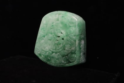 An apple green jadeite carved sword ornament