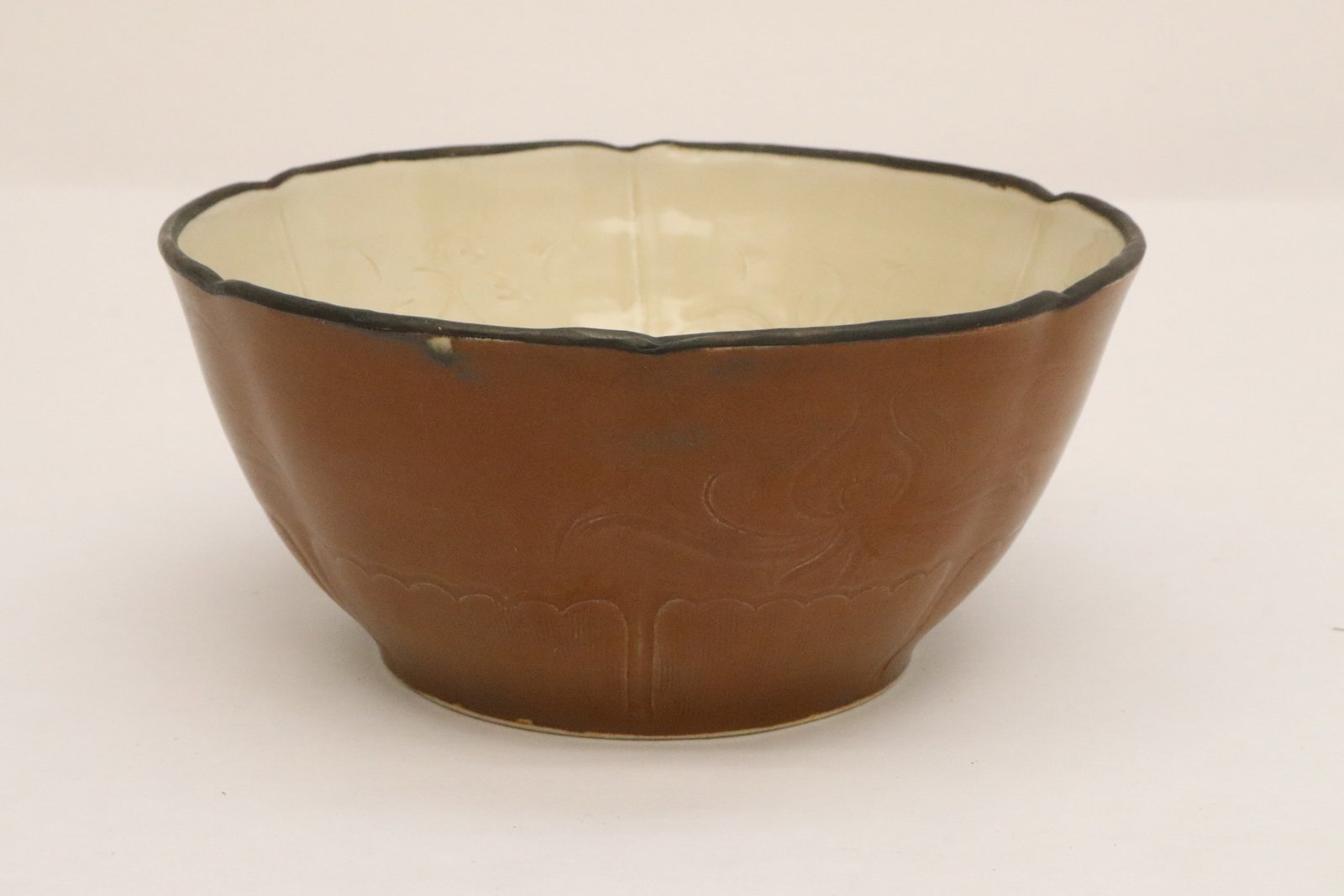 Chinese brown glazed bowl: Chinese brown glazed bowl with interior embossed with crane scene on bottom, 3.3"x7.15"dia