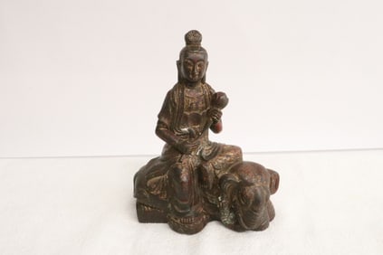 Bronze sculpture depicting deity riding on elephant