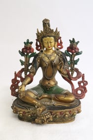 A polychrome bronze sculpture of deity