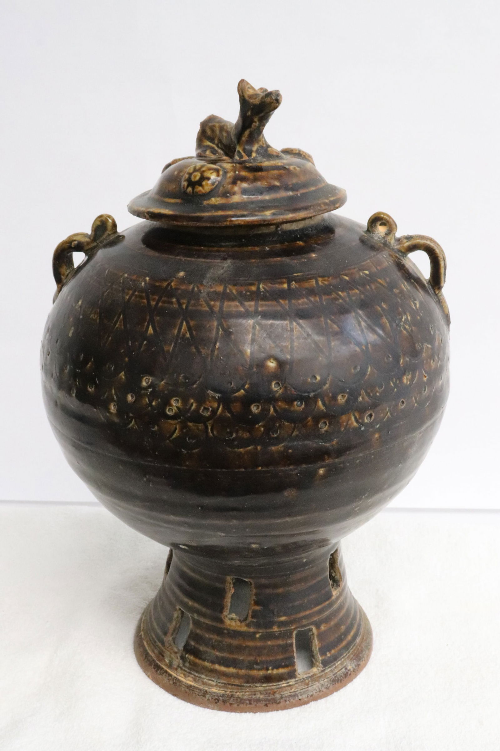 An brown glazed earthenware covered jar (1 of 9)