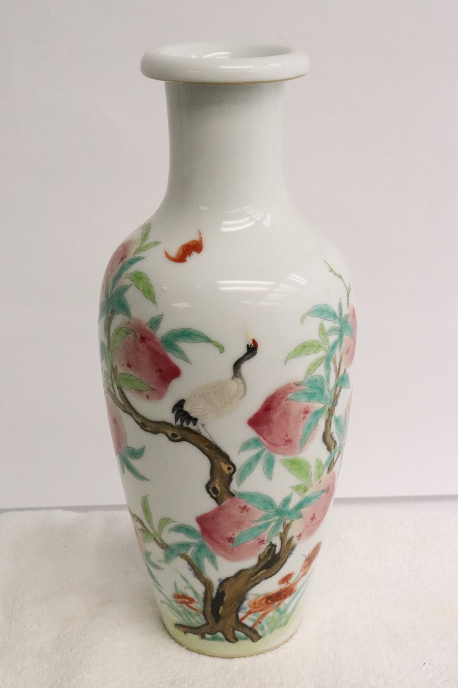 Chinese famille rose porcelain vase: A beautiful Chinese famille rose porcelain vase with peach tree and crane, 10.3"x4.35"dia