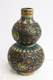 A cinnabar style gourd shape vase