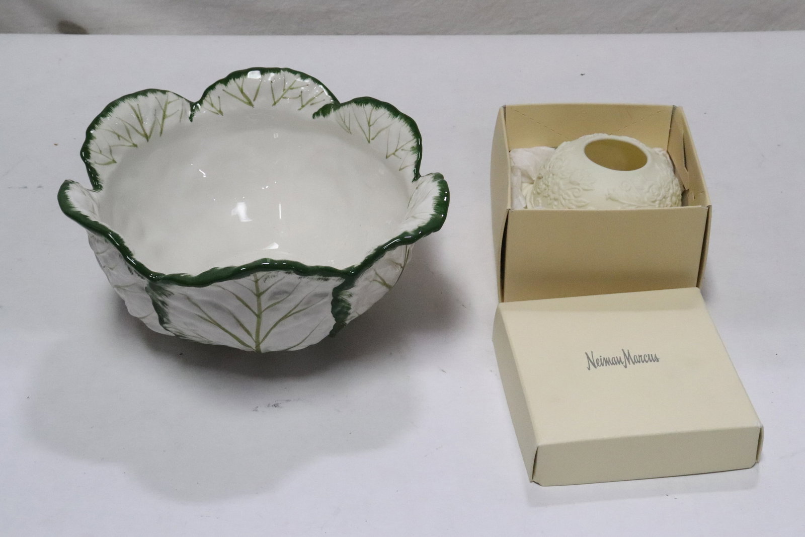 a Tiffany bowl, and a Neiman Marcus candle holder: 2 pieces; a Tiffany bowl (4.6"x10.3"x9.7"), and a Neiman Marcus candle holder (2.65"x5.1"dia)