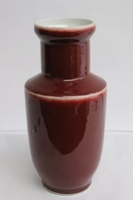 A red glazed porcelain vase