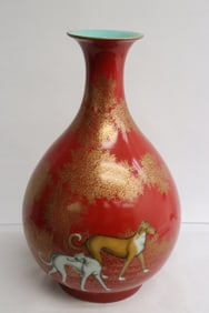 Beautiful gold on red porcelain bottle vase