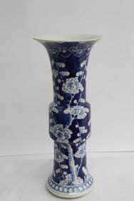 Chinese white on blue porcelain trumpet vase