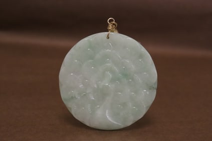 A light apple green jadeite carved pendant