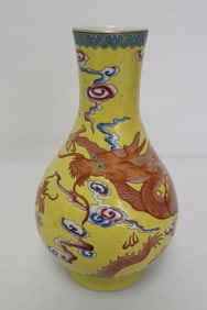 A yellow background famille rose porcelain vase