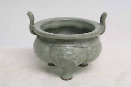A crackleware porcelain tripod handled censer