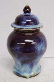 A blue on red porcelain covered jar
